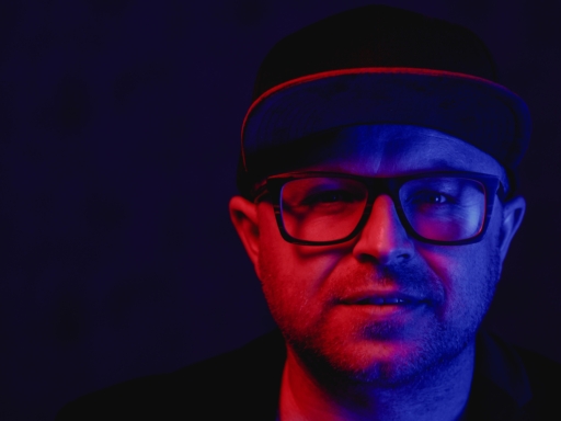 Portrait of the pop singer Anthony Weihs Portrait of the Dresden pop singer Anthony Wheis in red and blue disco light.