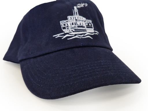 A souvenir from WEIßE FLOTTE SACHSEN GmbH - a blue baseball cap with an embroidered steamer motif.